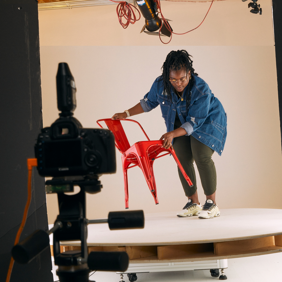 Content creation team setting up a photo studio Content creation team setting up a photo studio for a shoot
