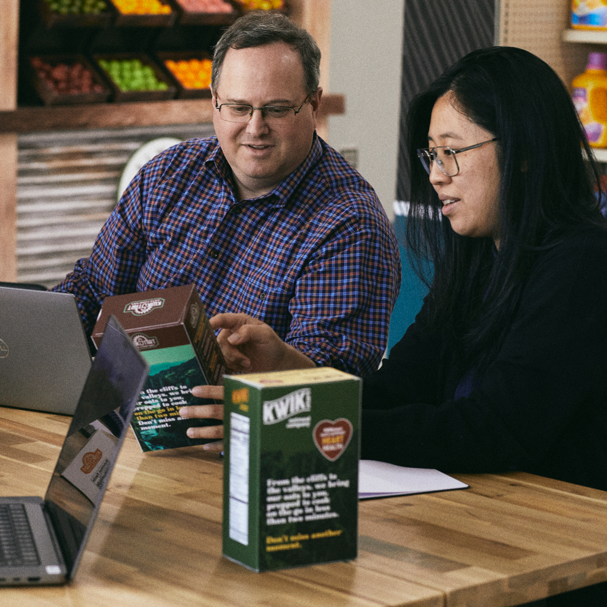 Marketing team discussing packaging strategy with a client Marketing team discussing packaging strategy with a client