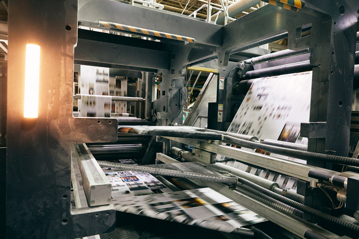 Quad printing press on the production floor Quad printing press on the production floor
